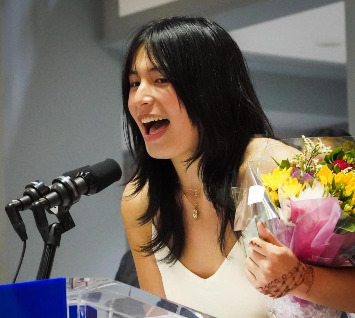 Mora speaking at the Youth Poet Laureate ceremony after being awarded the position 