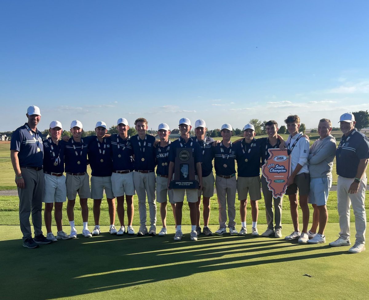 The team poses with the state championship trophy