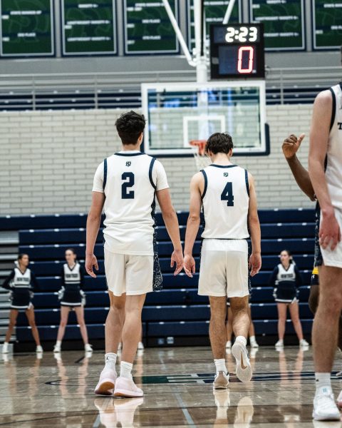 Kirkpatrick and senior guard MJ Burns get up the court during the team's game against Glenbrook South High School on Jan. 10