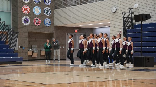 The New Trier Dance Team prepares to perform at the CSL competition.