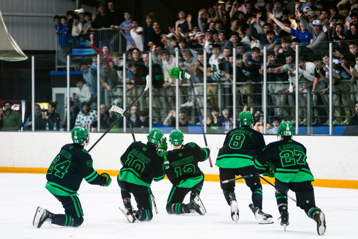 NTG's first line celebrates with Hirschtritt after the team's fourth straight goal