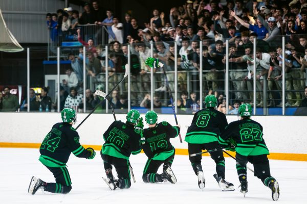 NTG's first line celebrates with Hirschtritt after the team's fourth straight goal