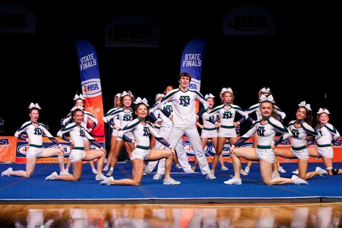 New Trier cheer poses in their IHSA State routine on Feb. 6