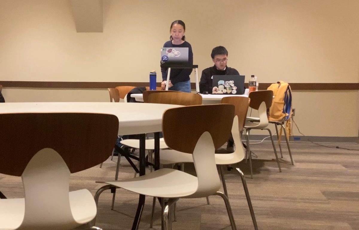 Renee Ma and Matt Peng prepare for a debate round at the Justin Wilson Debates Pace Round Robin in Atlanta, Georgia. The pair placed fourth at this prestigious tournament.