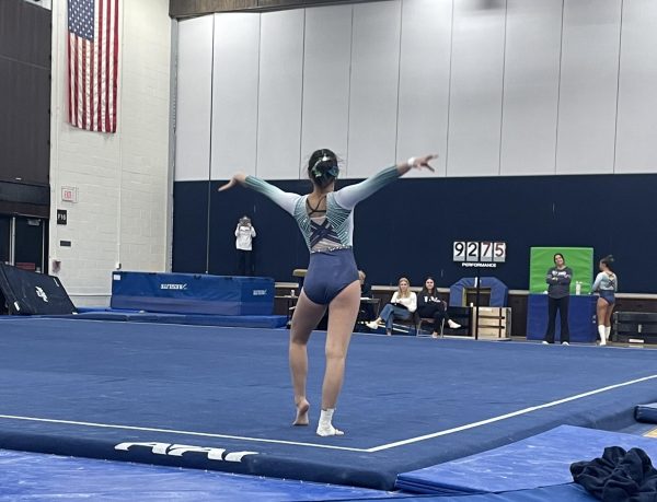 Sophomore Karis Park prepares to tumble in her floor routine at the IHSA Regional competition