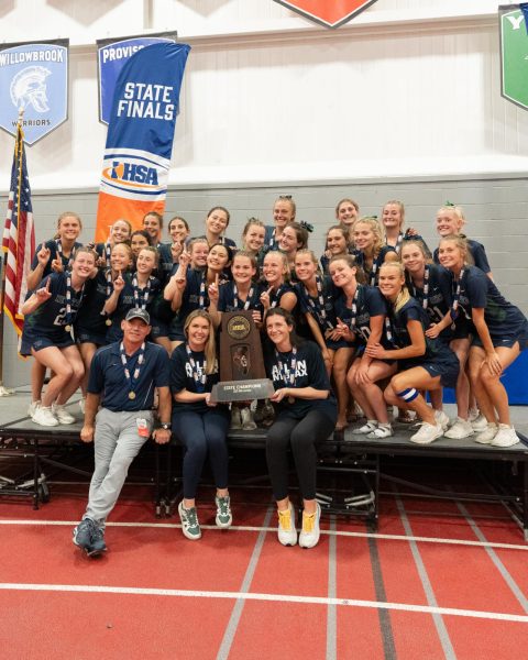 The Trevs hold their trophy after defeating Loyola Academy in the 2025 state championship